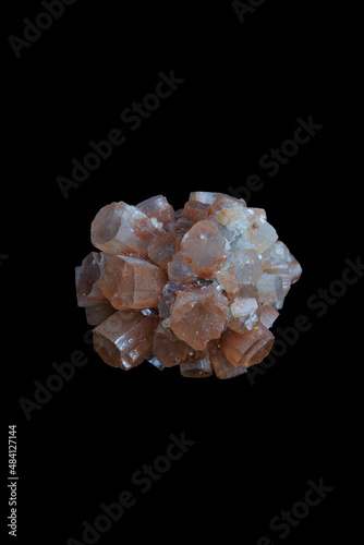 Aragonite crystal cluster, a mineral stone on black background.
