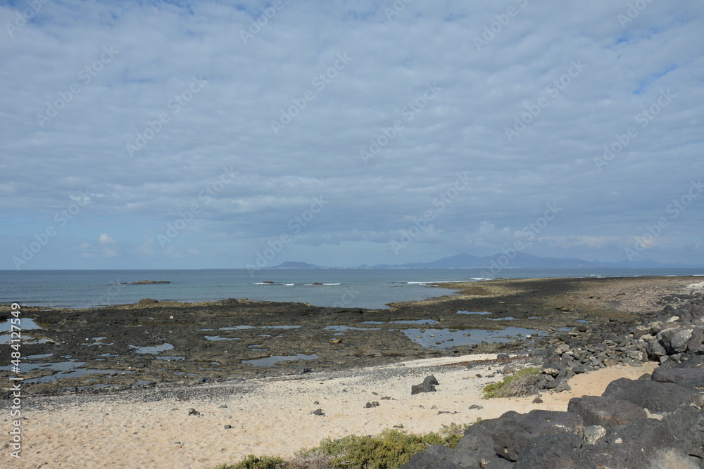 Bay full of volcanic stones in Bajo Ballena. El Cotillo La Oliva Fuerteventura Canary Islands.