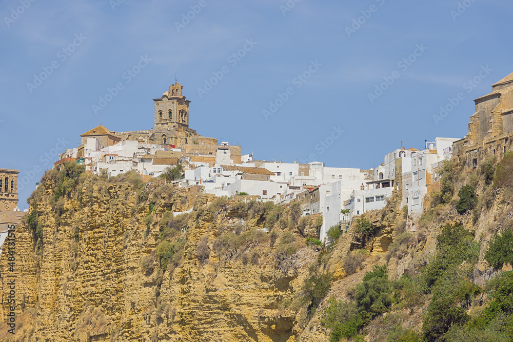 The upper part of Arcos de la Frontera with the San Pedro church seen from the bridge over the Guadelete river