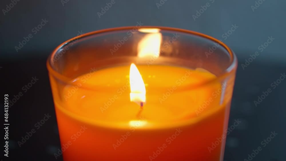 Candle on the table. Close-up. Slow motion Candle on the table. Close-up. Slow motion