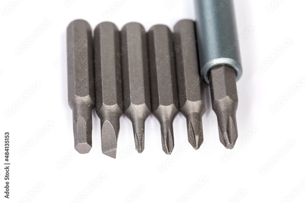 Set of different interchangeable bits for mini screwdriver, close-up Set of different interchangeable bits for mini screwdriver, close-up