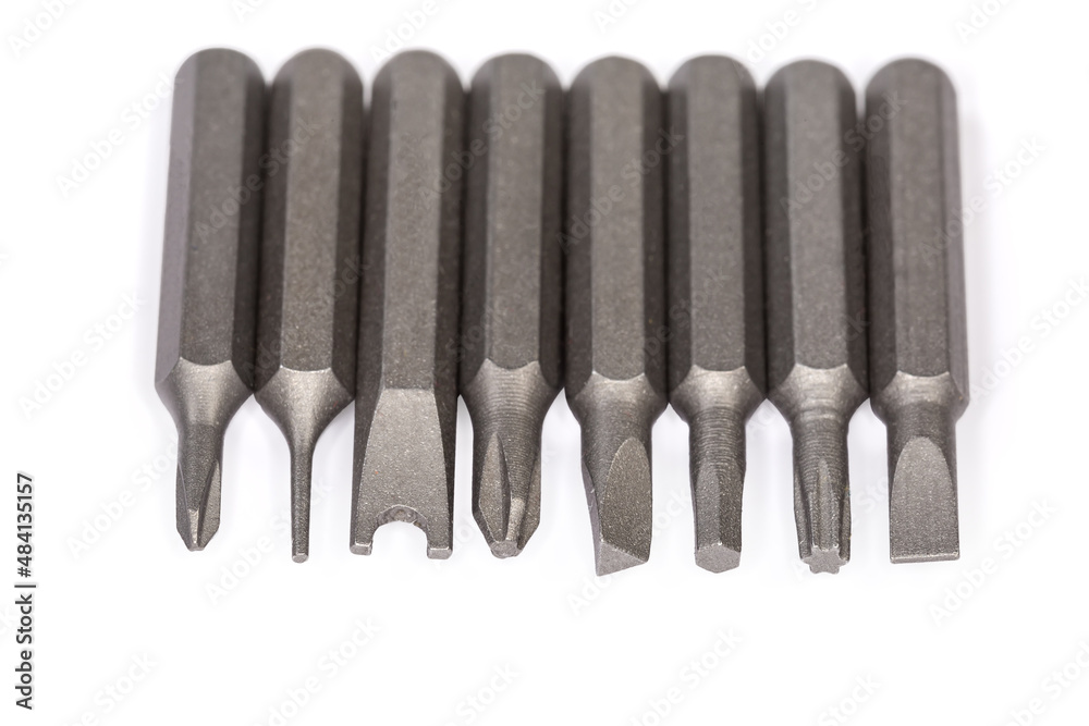 Set of different interchangeable bits for mini screwdriver, close-up Set of different interchangeable bits for mini screwdriver, close-up