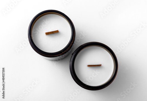 candles in dark glass candlesticks on a white background. insulation.