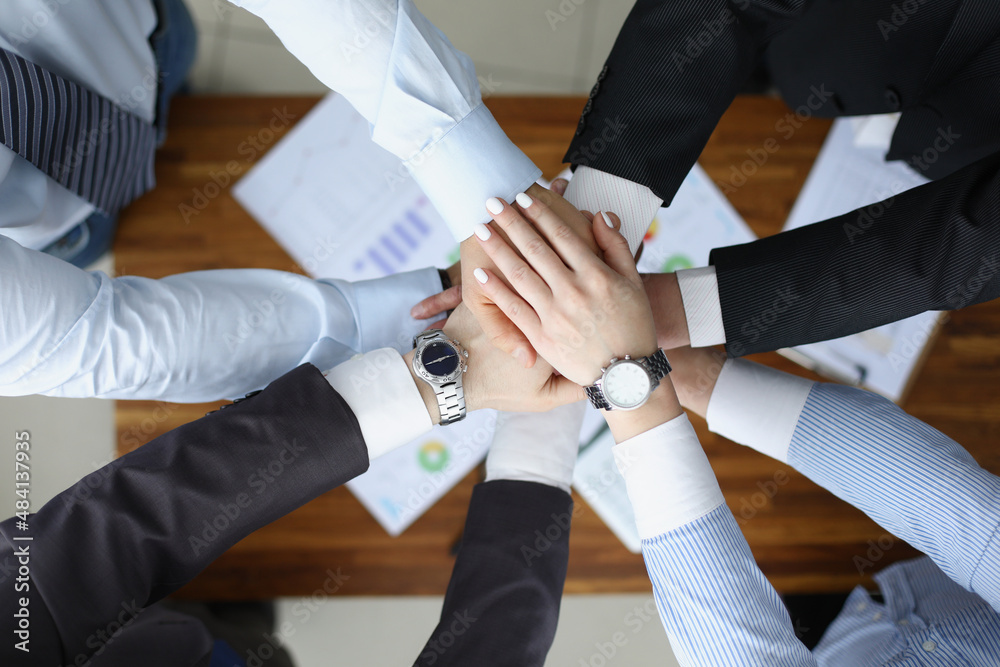 Fototapeta premium Colleagues performing gesture in order to prepare for important profitable project
