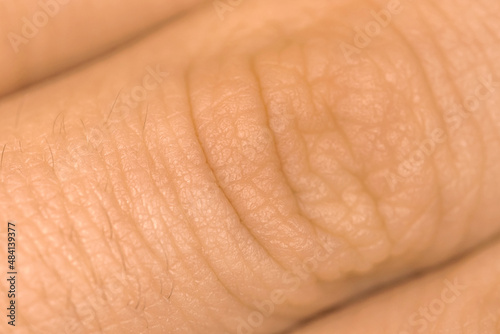 Human fingers skin texture. Detail healthy skin background. Young person  healthcare concept photo