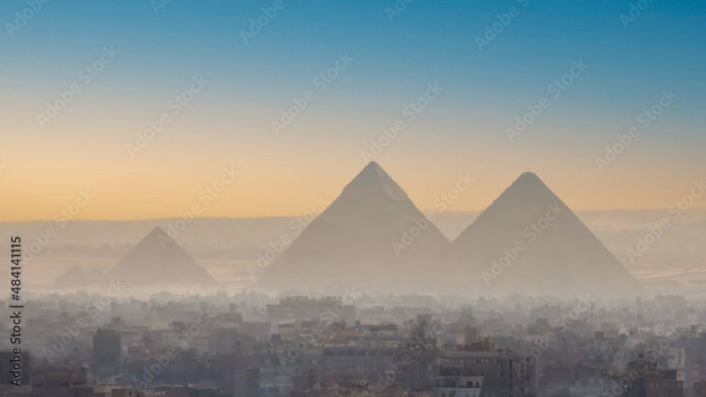 A view of the great pyramids of Egypt through the smog of Giza.
