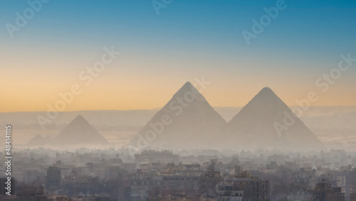 A view of the great pyramids of Egypt through the smog of Giza.