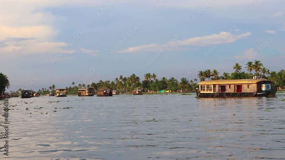 houseboats running in sea backwater with amazing sky at morning houseboats running in sea backwater with amazing sky at morning