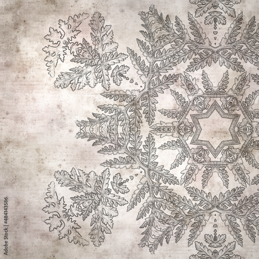Obraz premium stylish textured old paper background with kaleidoscope snowflake