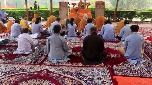 monks offering their morning pryers to almighty god at ancient traditional temple at morning photo