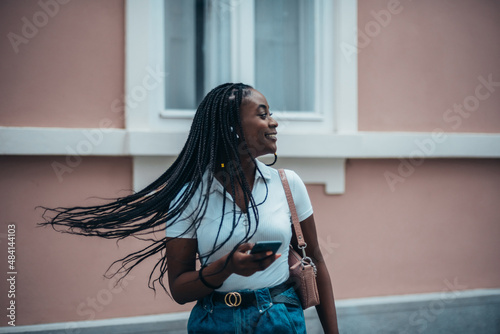 Beautiful african american woman using smartphone photo