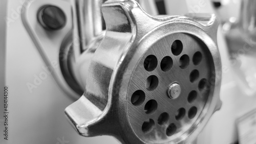 Meat grinder. Metal knife for meat grinder. Household appliances for the kitchen.