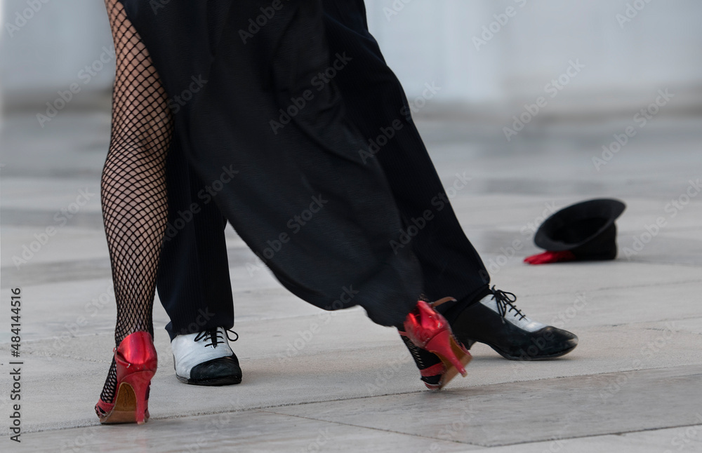 Fragment photo of tango dancers. Only legs, tango dancers. Milonga. Man and woman dancing tango, nice sexy legs of tango dancer, woman with high heels, black and white photo - obrazy, fototapety, plakaty 