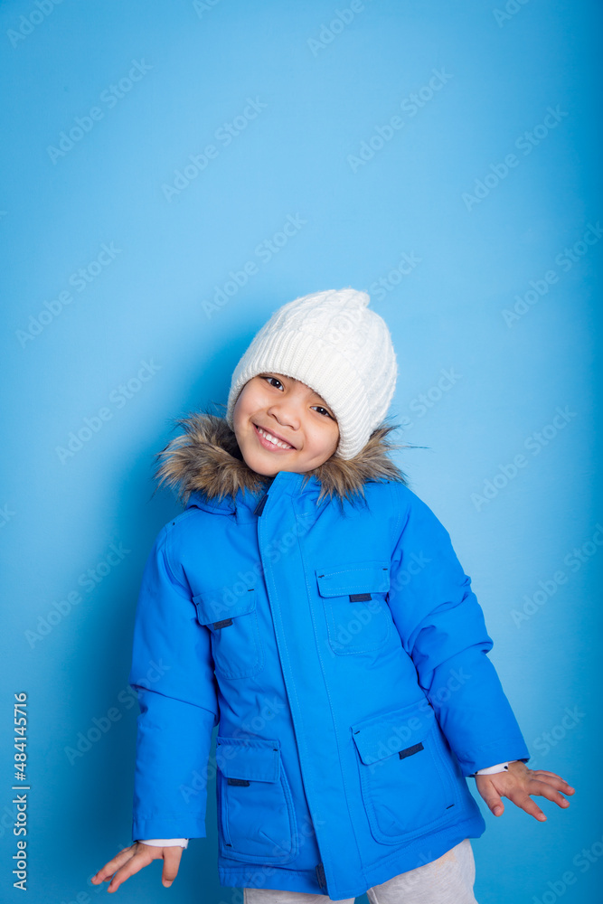 little Asian model smiling with winter clothes prepared to ski little Asian model smiling with winter clothes prepared to ski