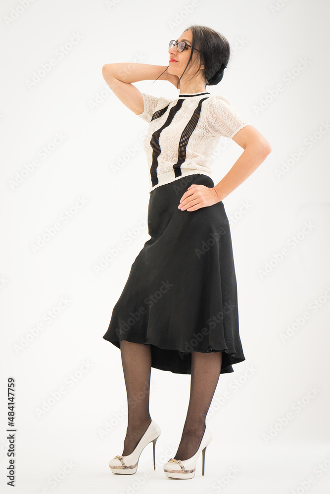 Studio photo of middle aged woman starting getting grey-haired wearing black and white clothes on white background, middle age sexy lady, happy life concept Studio photo of middle aged woman starting getting grey-haired wearing black and white clothes on white background, middle age sexy lady, happy life concept