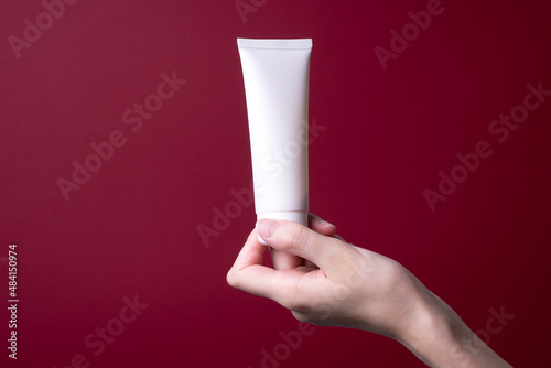 packaging of hand cream in female hands