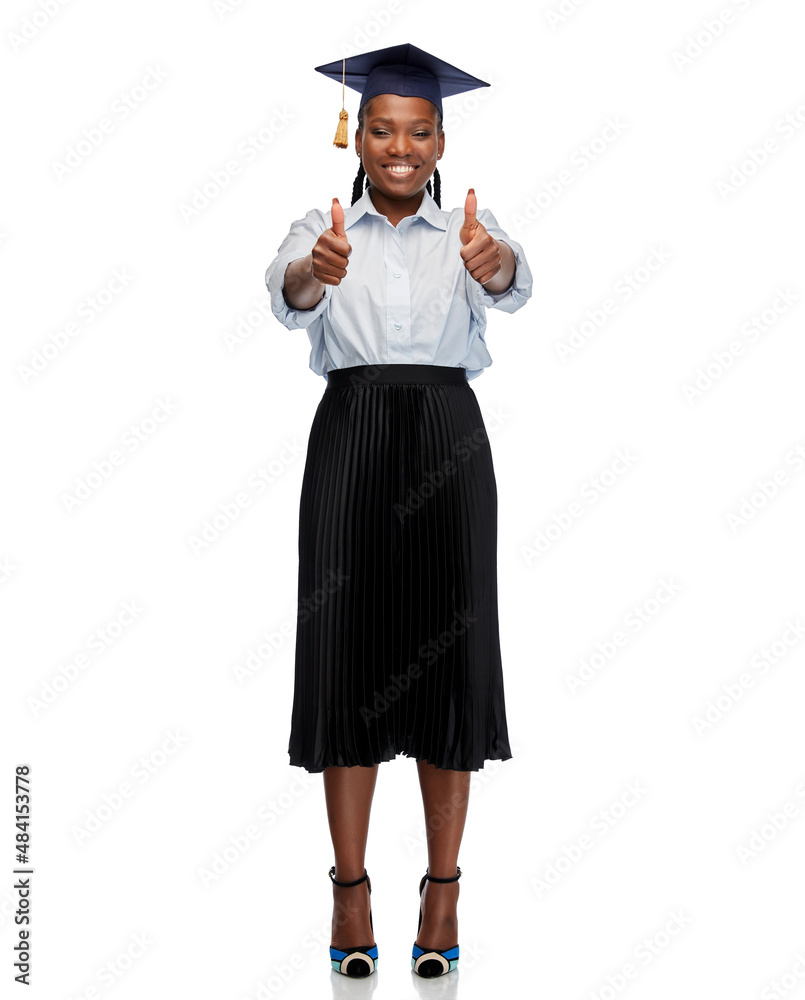 education, graduation and people concept - happy graduate student woman or bachelor in mortarboard showing thumbs up over white background education, graduation and people concept - happy graduate student woman or bachelor in mortarboard showing thumbs up over white background