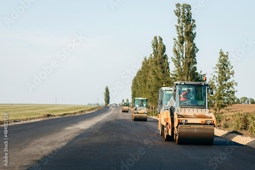 Wallpaper Mural Vibratory asphalt roller compactor compacting new asphalt pavement. Road service repairs the highway Torontodigital.ca