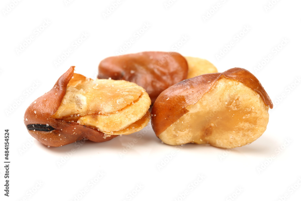 fava bean, roasted and salty on white background fava bean, roasted and salty on white background