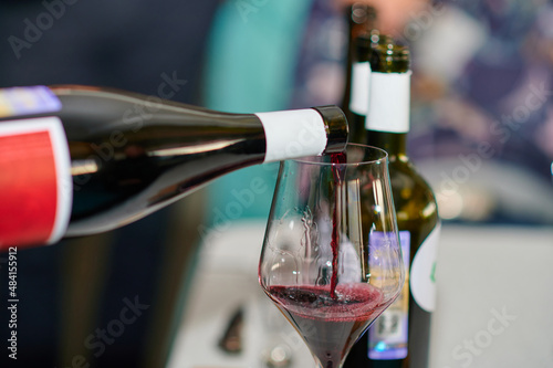 pours wine