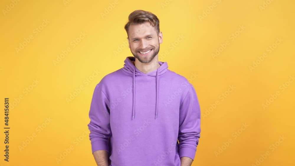 Milllennial person guy beaming smiling isolated bright color background Milllennial person guy beaming smiling isolated bright color background