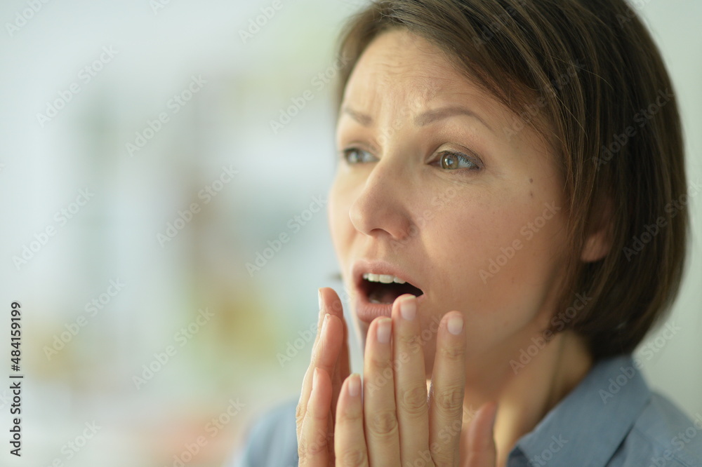 beautiful young ill woman at home