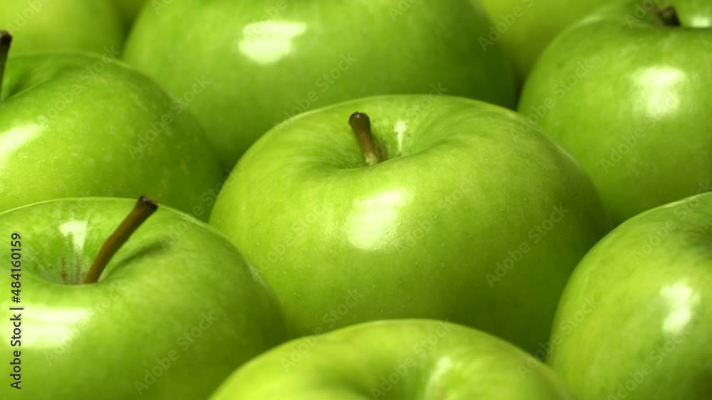 Fresh ripe green apples rotation background. Loop motion