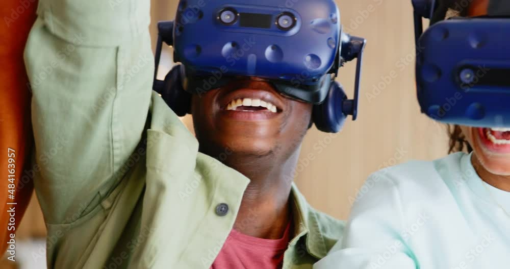 Laughing teen friends using vr headsets