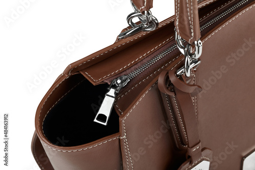 Closeup of brown leather zippered handbag with chrome fittings isolated on white