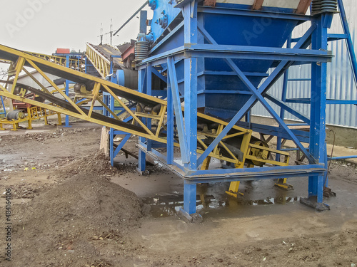 Vibratory Bunker for Unloading Raw Materials to The Receiving Part of the Belt Conveyor as Part of the Technological Line of the Metallurgical Processing Plant
