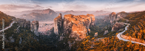 Inspirational aerial panoramic view of iconic and majestic Meteora monastery travel destination and winding road in Greece. Discover new tourist experience © EdNurg