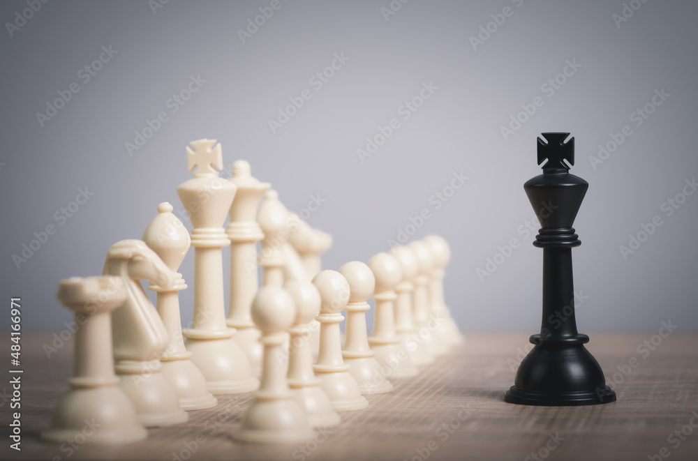 competition success play. strategy,teamwork, management or leadership concept. One chess pieces staying against full set of chess pieces. Strategy, Planning and Decision concept. 