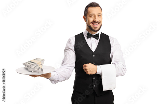 Male server holding a plate with stacks of money photo