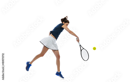 Studio shot of young sportive woman, tennis player training alone isolated on white background. Action, summer sports, fitness, sport concept. © master1305