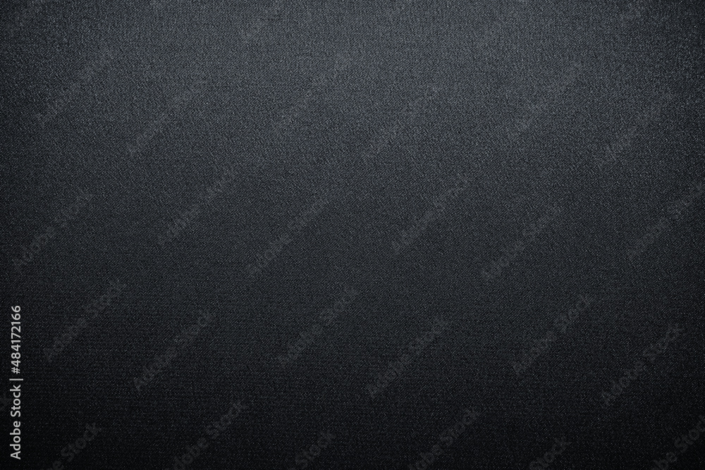 Abstract black background. Gradient. Dark gray fabric background with space for design.