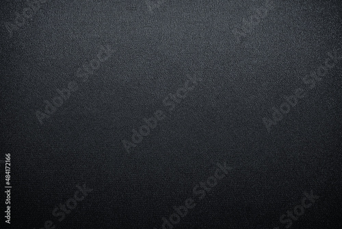 Abstract black background. Gradient. Dark gray fabric background with space for design.