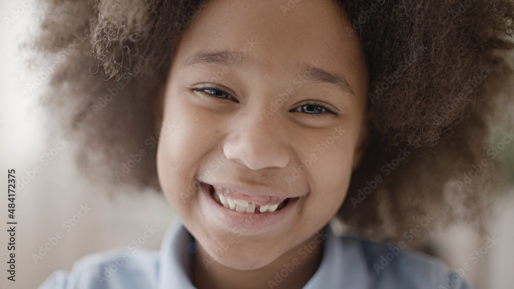 Pretty african american girl smiling, showing missing tooth, dental care for children Pretty african american girl smiling, showing missing tooth, dental care for children