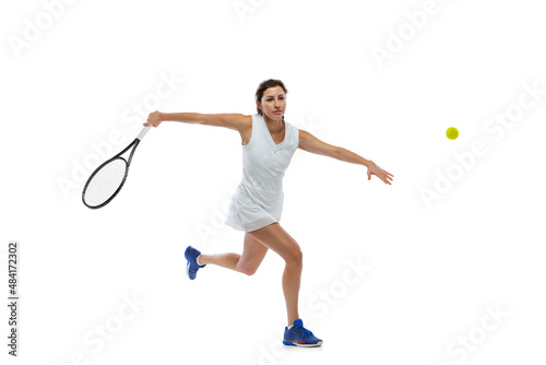 Portrait of young sportive woman, tennis player playing tennis isolated on white background. Healthy lifestyle, fitness, sport, exercise concept.