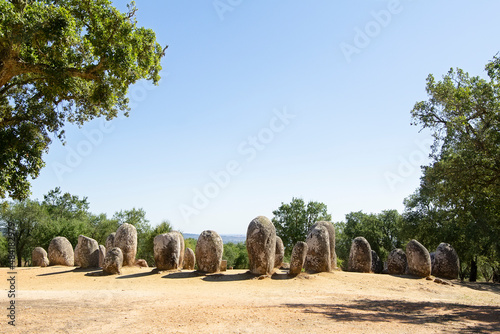 neolithic stones circle on Almendres Cromlech a megalithic complex of more than 100 stones in Alentejo region , Evora, Portugal