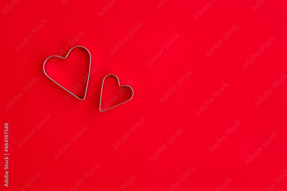Valentine's day two hearts on red background, space for text