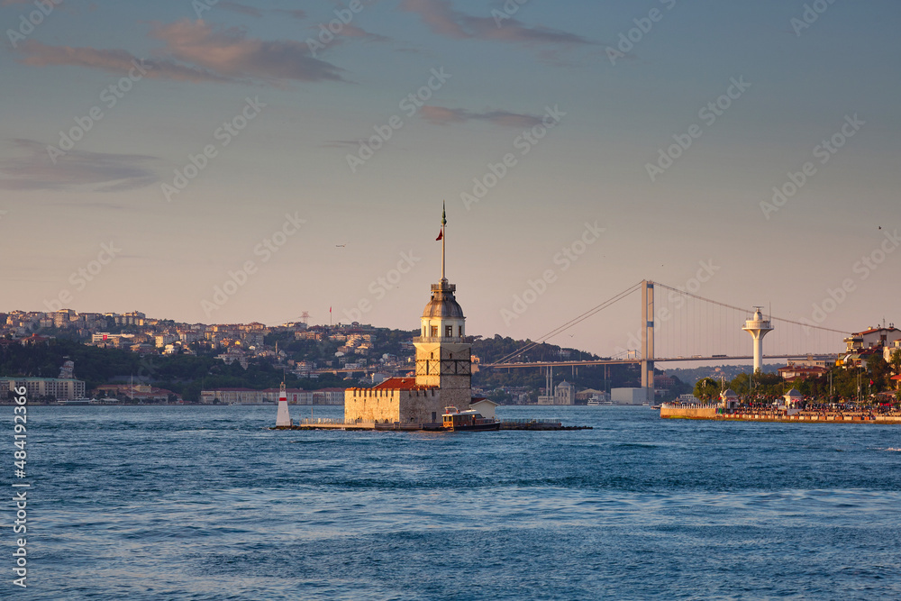 Istanbul in the evening. View of the Bosphorus, the Maiden's Tower and the bridge. Travel to Istanbul, Turkey.