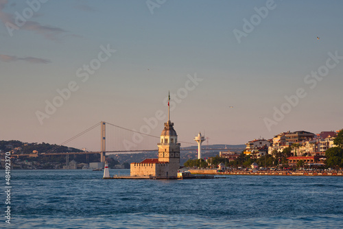 Istanbul in the evening. View of the Bosphorus, the Maiden's Tower and the bridge. Travel to Istanbul, Turkey.