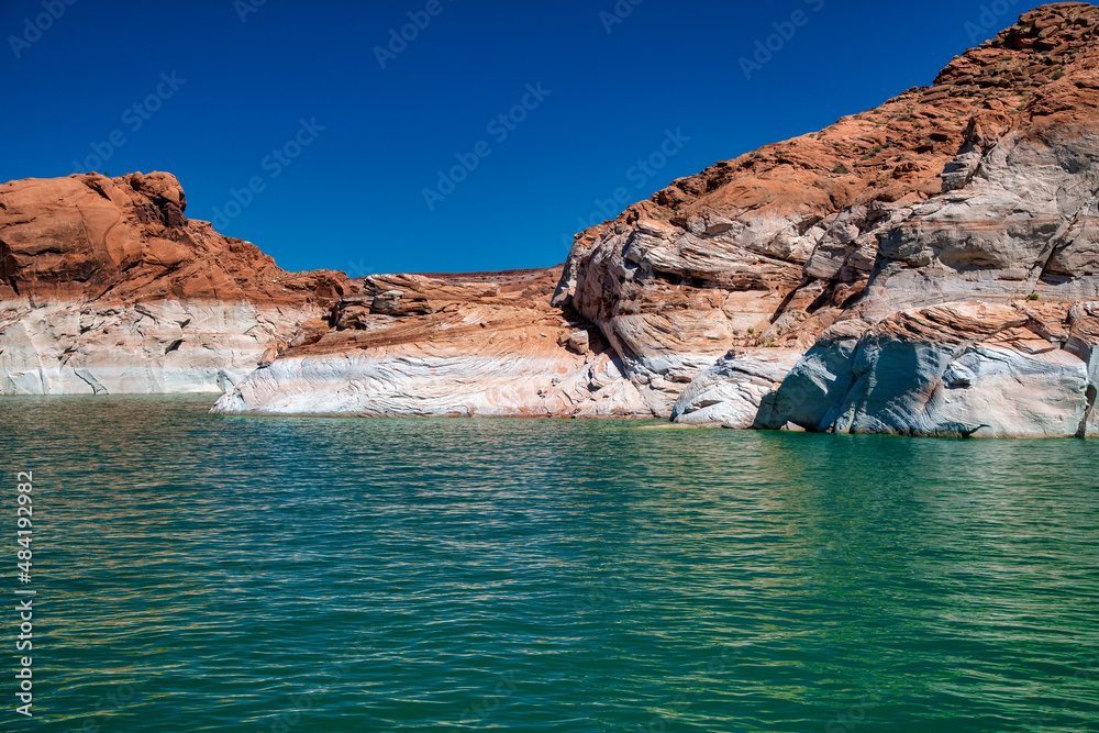 Cruise along Lake Powell. View of narrow, cliff-lined canyon from a boat in Glen Canyon National Recreation Area, Arizona..