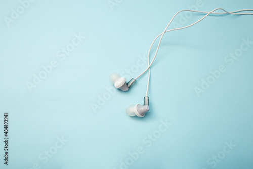 Headphones for gadget on background © Tetiana Romaniuk