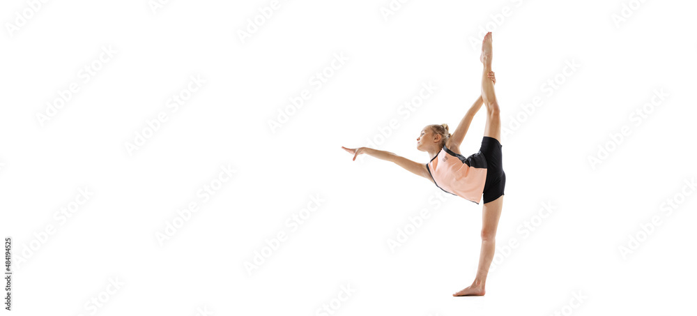 Little flexible girl, rhythmic gymnastics artist isolated on white studio background. Grace in motion, action. Doing exercises in flexibility. Little flexible girl, rhythmic gymnastics artist isolated on white studio background. Grace in motion, action. Doing exercises in flexibility.
