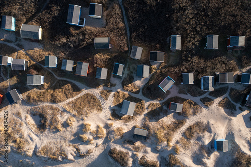 Tisvildeleje, Denmark - January 21, 2022: Aerial drone view of wooden beach huts in the sand dunes photo