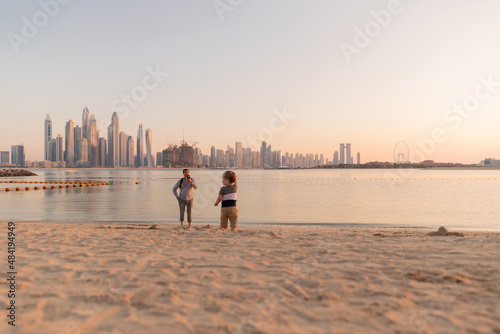 beautiful little boy with man, father and son, on the beach in a Dubai palm tree © Светлана Назарова