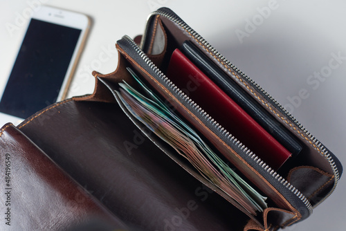 wallet with money passport and phone
