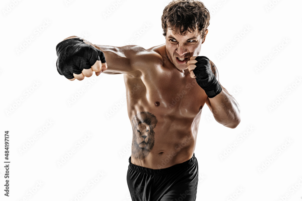 Portrait of aggressive boxer who training and practicing swing on white background. Sport concept 