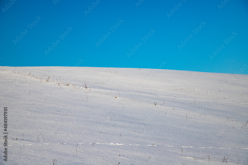 white snow and blue sky background